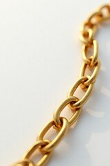 Fototapeta premium Shiny gold chain with intricate links on white background, jewelry, metal