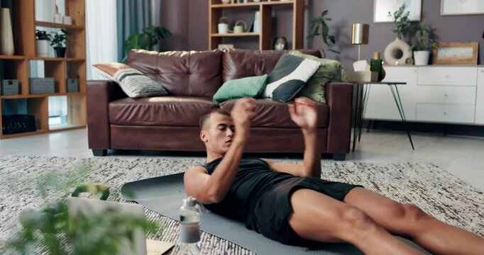 Laptop, fitness and crunches with man in home for streaming exercise class, learning and health. Workout, wellness and training with person in living room for sports, virtual course and core strength