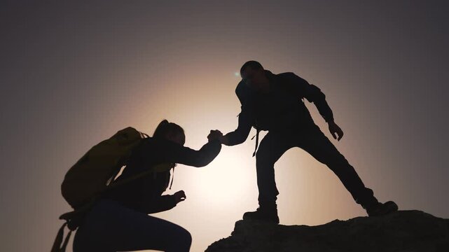 Adventure climb, helping hand in nature. Teamwork trust hand helping climb. Hikers summit, mutual aid for mountain climb. Helping hand concept, adventure travel ascent. Hand friends climb together.