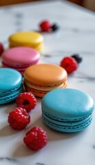 Fototapeta premium Close-up shot of colorful macarons with fresh raspberries and dark berries, arranged on a marble surface, suggesting a bright, modern, and elegant dessert setting.