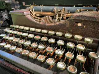 Old rusty antique typewriter on the table