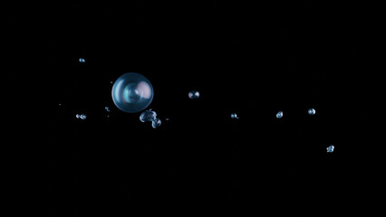 3D visualization of water bubbles and liquid balls floating and splashing chaotically on a dark background. The scene captures the essence of underwater breathing, ideal for abstract patterns or