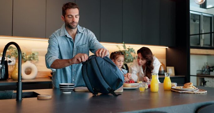 Family, child and morning with bag for school, breakfast or getting ready together in kitchen at home. Mom, dad and daughter with lunch, meal or food in preparation for kindergarten snack at house