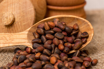 Cedar nuts on rustic background, natural and healthy food concept