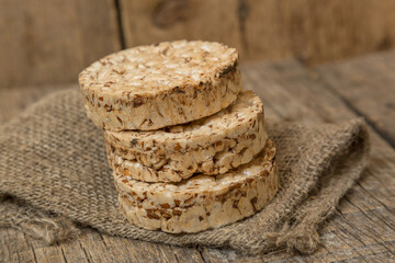 Wheat cakes, unleavened bread, close-up shot on an old wooden table, rustic homemade food