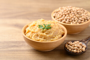 Miso paste in wooden bowl, Japanese seasoning made from fermenting soybeans with salt, Traditional food ingredient in Japanese cuisine