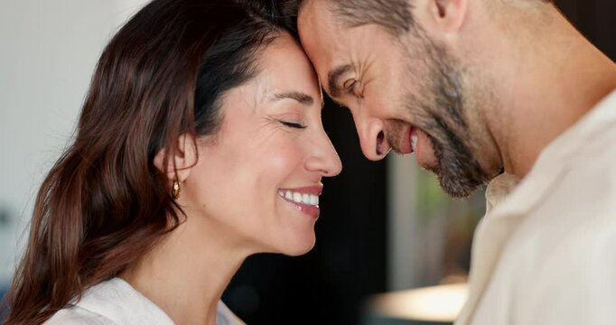 Forehead, house and couple with romance, smile and bonding together in living room. People, apartment and man with woman, relationship and marriage with trust, humor and affection with love and funny