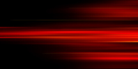 The effect of red light in fast motion on a black background. blurred abstract background with long exposure. neon light