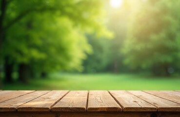 Wooden table top on blurred green park background. Empty rustic wood desk, sunlit nature backdrop for product display, food picnic or spring, summer montage.
