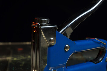 not a new construction blue stapler for fastening building materials and home repairs