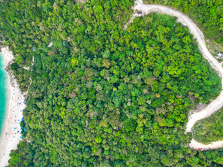 Top-down aerial view of a scenic hiking trek through the lush forest and mountains in Phuket, Thailand – nature adventure landscape