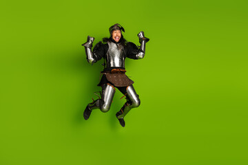 Energetic medieval knight jumping joyfully against a vibrant green background