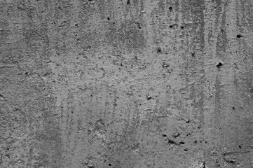gray background, photo shows texture of concrete wall with remains of old paint