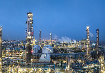 Aerial view of illuminated oil refinery and chemical plant at night
