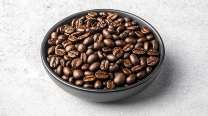 Fototapeta premium Aromatic whole coffee beans in black bowl on stone background for cafe decor and beverage design