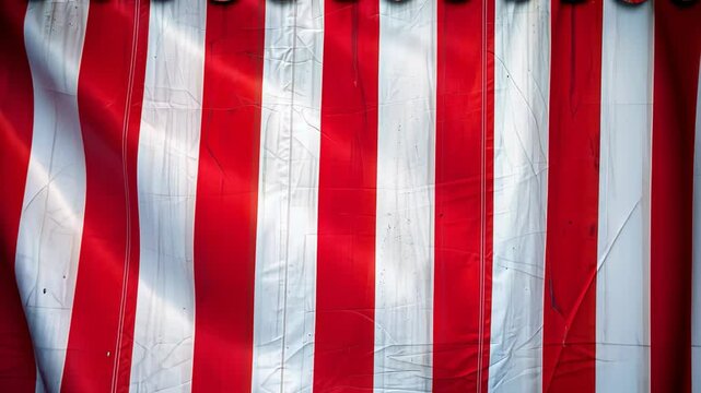 Striped red and white circus tent fabric creating a vibrant background.