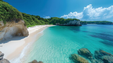 Obraz premium A breathtaking wide-angle view of a tropical beach with white sand, crystal-clear turquoise waters, and lush greenery. Highlighting the serene landscape with an isolated rock formation.
