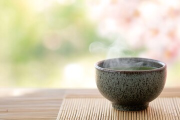 Steaming matcha tea close-up traditional ceramic bowl bamboo setting