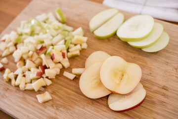 A variety of apples on a cutting board