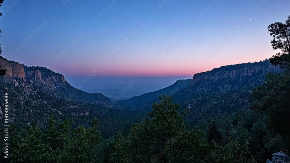 Poster Sunset view over a serene valley with lush trees and rugged cliffs in a quiet natural setting