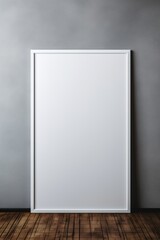 Empty White Frame in a Room with Gray Walls and Wooden Floor