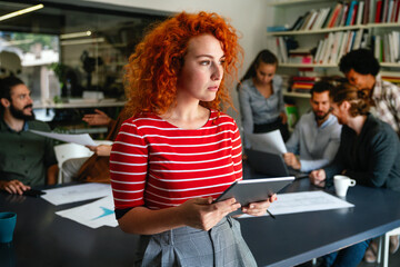 Software, coding and business woman on tablet thinking of data analytics, digital technology.