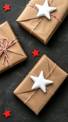 Three rustic brown gift boxes tied with twine and adorned with white stars, scattered on a dark surface with red star confetti.  Perfect for holiday or celebration themes.
