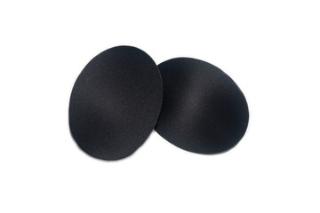 Two matte black oval objects on a white background arranged in a minimalist abstract layout