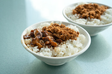 Braised pork belly meat over cooked rice with pan-fried milkfish.