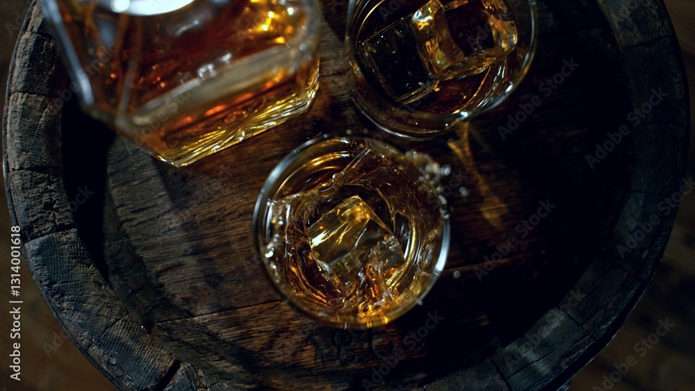 Poster detail of pouring ice cube into whiskey. freeze motion drink preparation.