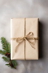 A Festive Holiday Gift Wrapped in Brown Paper and Twine