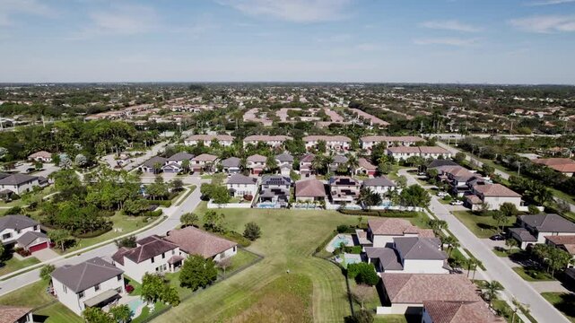 Aerial: West Palm Beach residential zone during the day, establishing drone shot, USA