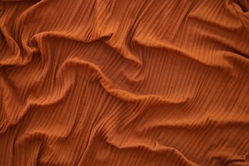 Bright orange fabric background from a piece of crumpled clothes