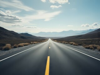 Fototapeta premium Endless desert highway, open road travel with mountains in the distance. Vast desert landscape with view to horizon by road, scenic road trip