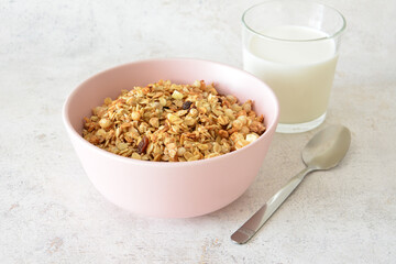 muesli in pink bowl with Milk and spoon quick breakfast