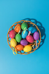 Collection of decorative and colorful Easter eggs on a blue background. Easter card.