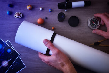 Person with telescope and compass for the exploration of the planets