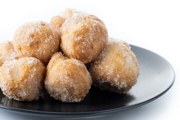Traditional Carnival fritters or buñuelos de viento isolated on white background. Close up