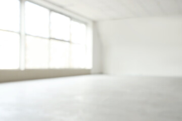 Fototapeta premium Blurred view of big empty room with large window