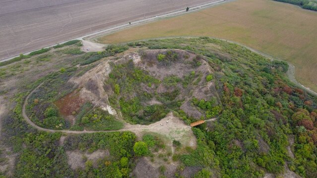 Eroded Extinct Volcano Crater in Pannon Geopark, Hungary. Volcanic landscape, eroded, extinct volcano.  round crater, magma and lava eruptions. Stunning geothermal landscape. Geopark, geotourism. 