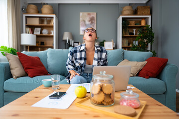 Frustrated angry business woman using laptop computer getting problems, software mistakes, wrong app work, system errors, receiving bad news, doing home paperwork, feeling annoyed, worried, concerned.