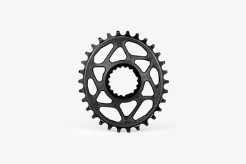 Black oval bicycle chainring against white isolated background, floating above the surface....