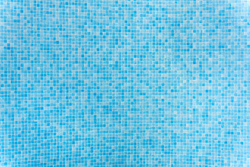 Blue mosaic tiles creating refreshing swimming pool texture