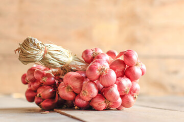 red onion on wooden table background