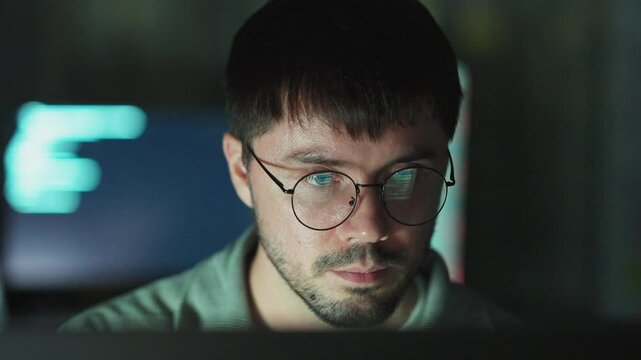 Cyber engineer analyzing data systems, ensuring streamlined digital communication and security.