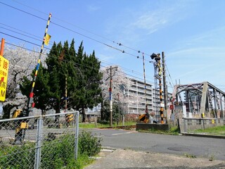 It says "Ube Shinkawa Station" in Japanese. Ube Shinkawa Station in Yamaguchi Prefecture, Japan is the station that appeared in the last scene of the movie "Evangelion: 3.0". It means that Evangelion 