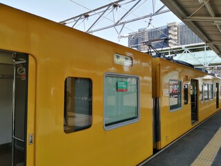 It says "Ube Shinkawa Station" in Japanese. Ube Shinkawa Station in Yamaguchi Prefecture, Japan is the station that appeared in the last scene of the movie "Evangelion: 3.0". It means that Evangelion 
