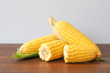 Fresh corn on wooden table background