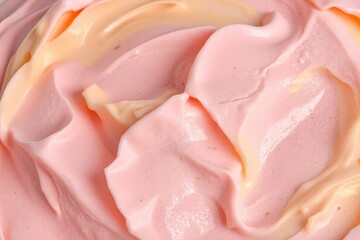 Close-up photograph of creamy pink ice cream with vanilla swirl, dark specks, smooth texture, and bright lighting highlighting indulgent appearance
