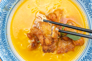 top view sour soup noodles with chicken at horizontal composition
